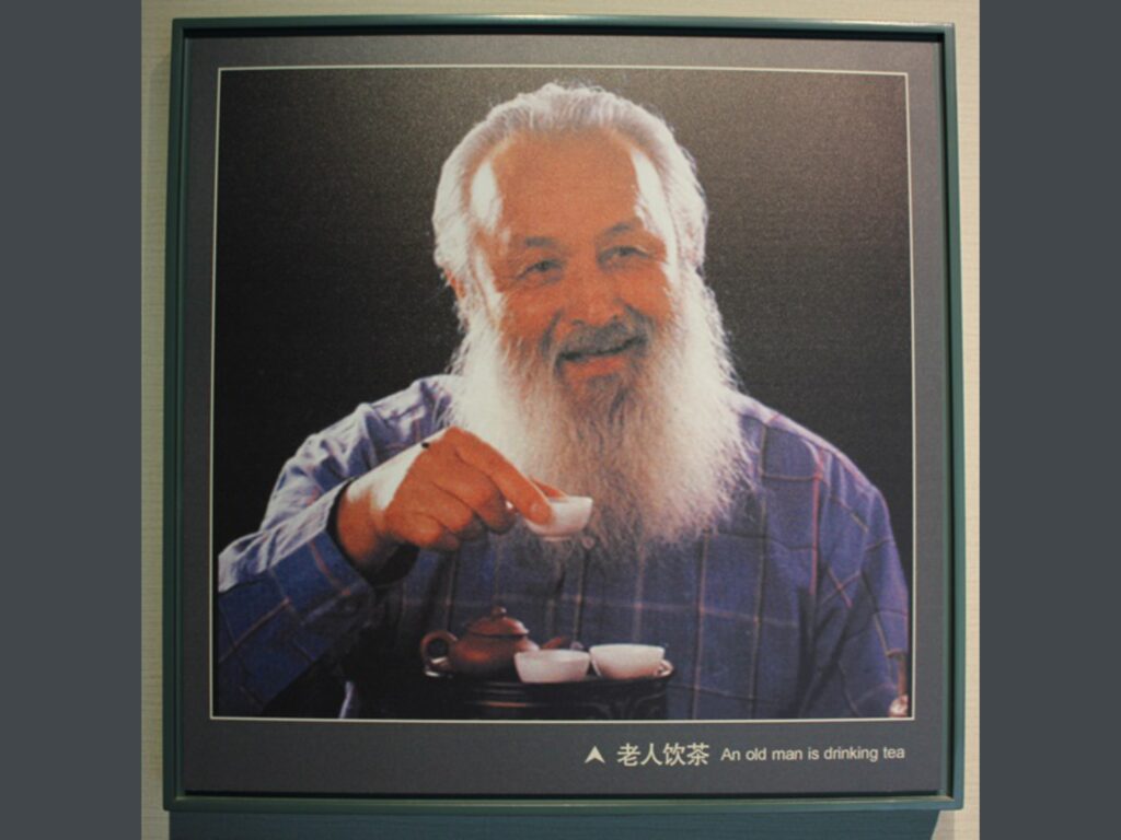 portrait of an old man drinking tea