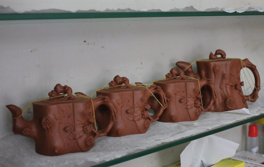 unfired yixing teapots on a shelf
