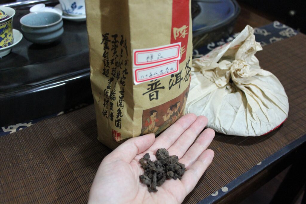 old pu'er tea displayed in a hand