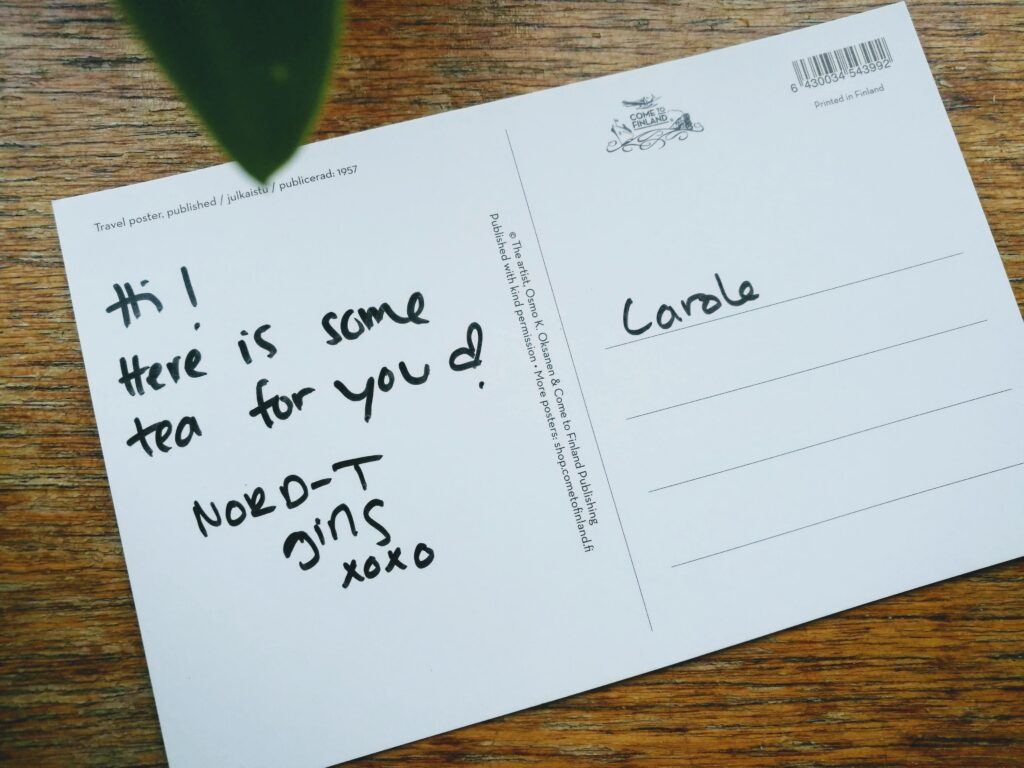 cof back of a postcard with writing