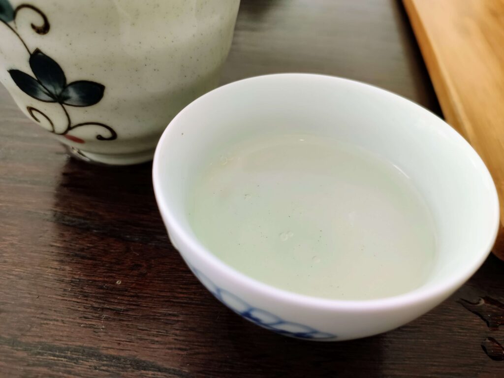 Dong Ding Liquor very pale tea liquor in white ttea cup