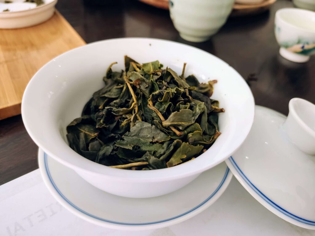 Dong Ding Wet wet tea leaves in white gaiwan