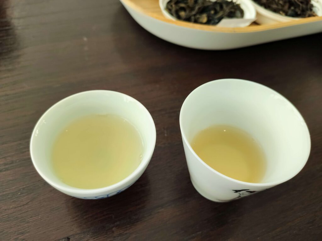 Liquor_DuckShit_HuangzhiXiang 2 white tea cups containing tea liquor