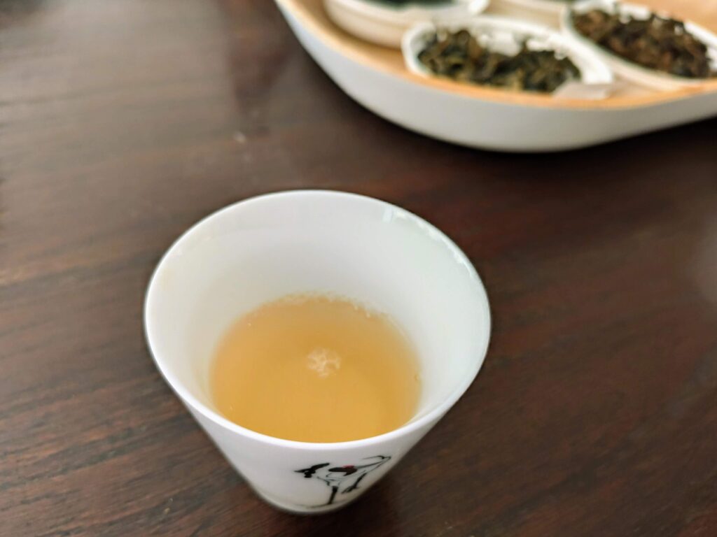 white tea cup containing tea liquor