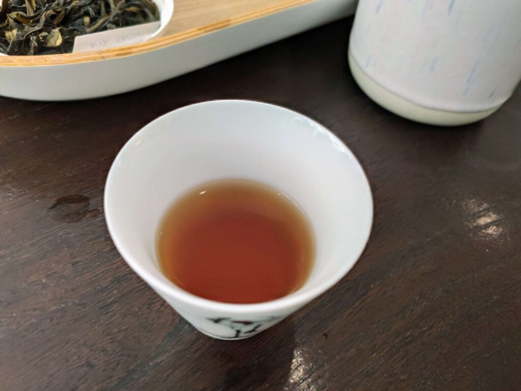 Liquor_ShanGan white tea cup containing tea liquor