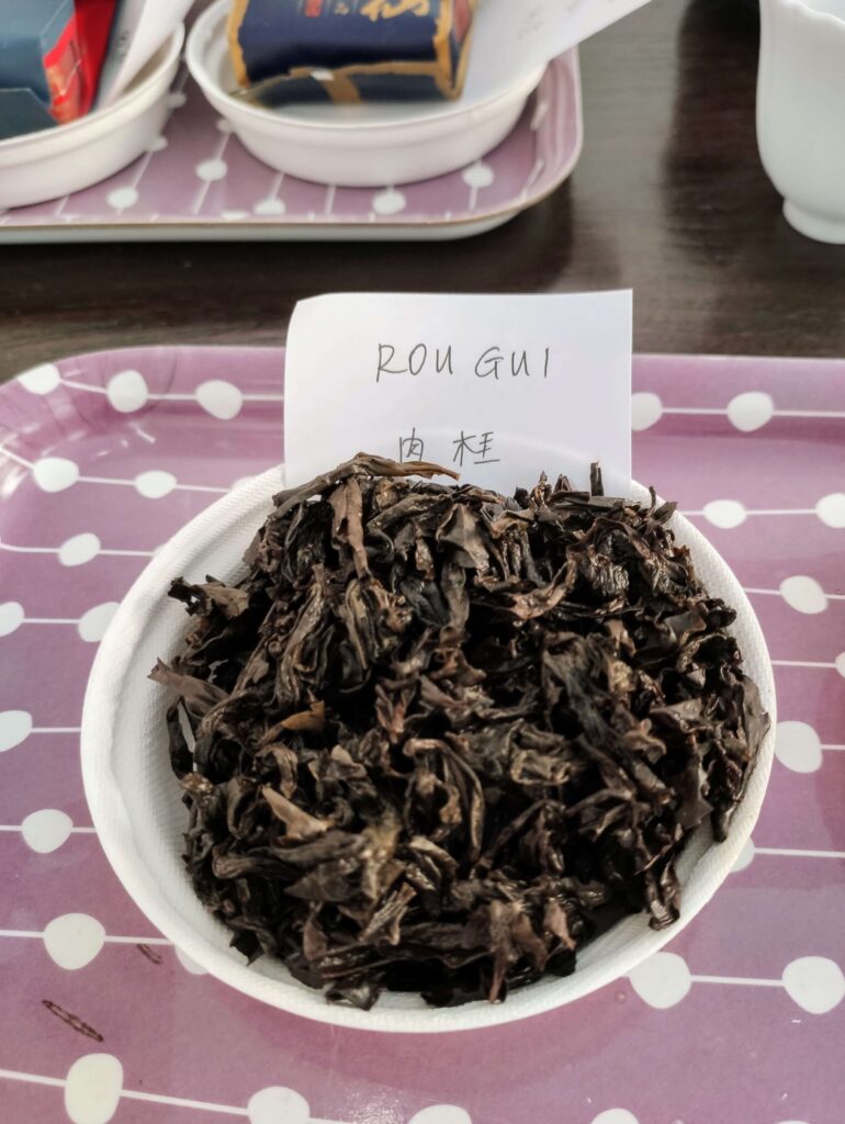 Rou Gui Wet wet tea leaves on white plate