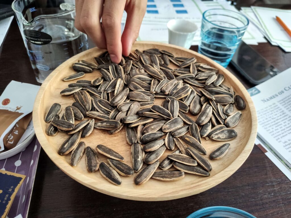 Sunflower Seeds sunflower seeds on a wooden plate