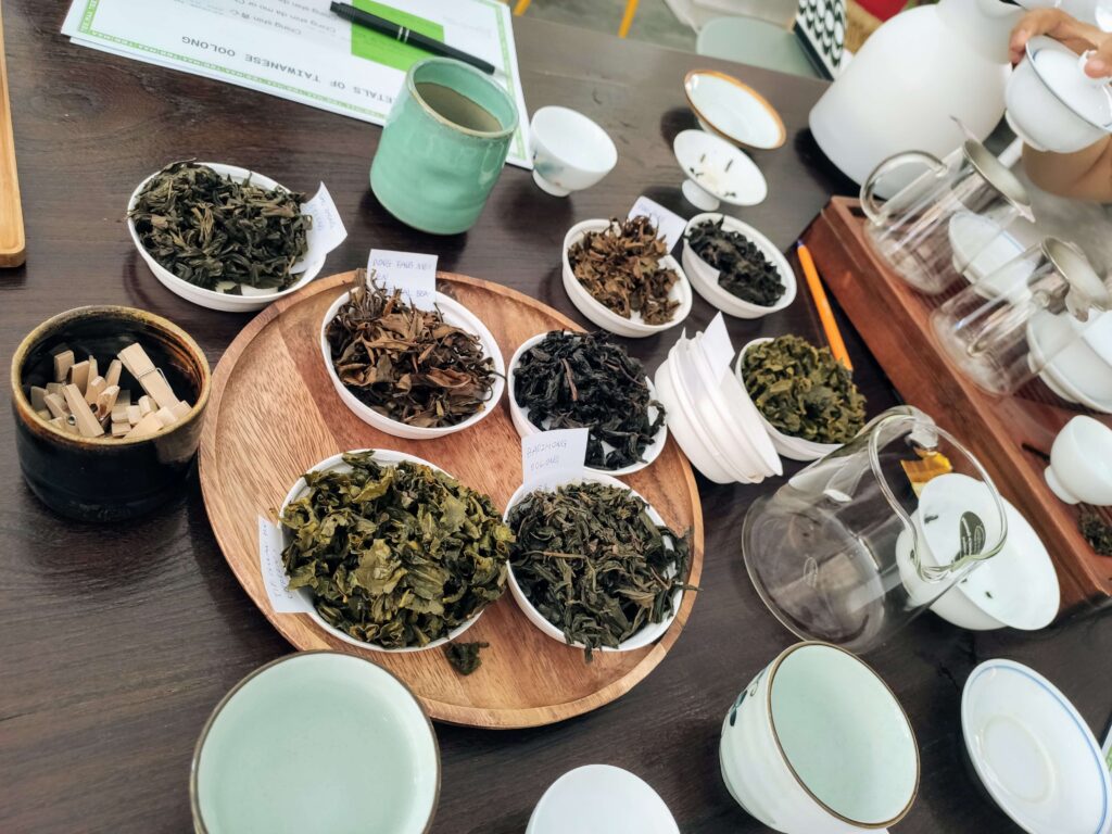 Tea Tasting Table Oolongs TeeMaa several plates of wet tea leaves