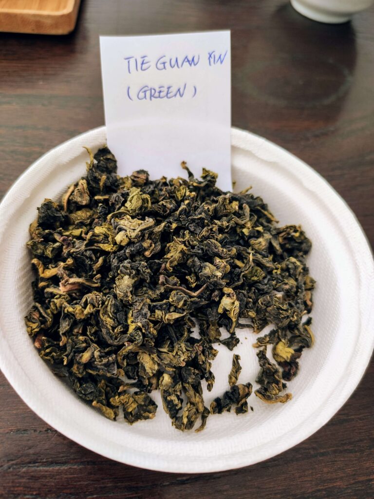 dry tea leaves on white plate