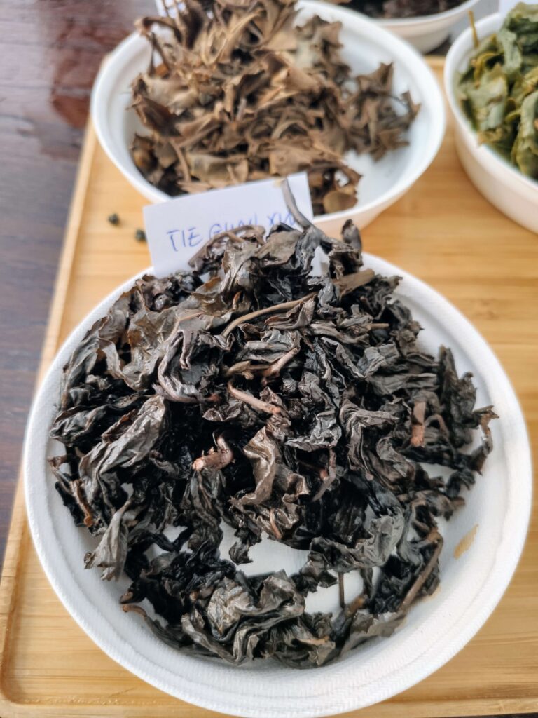 TieGuanYin Taiwan Wet2 wet tea leaves on white plate