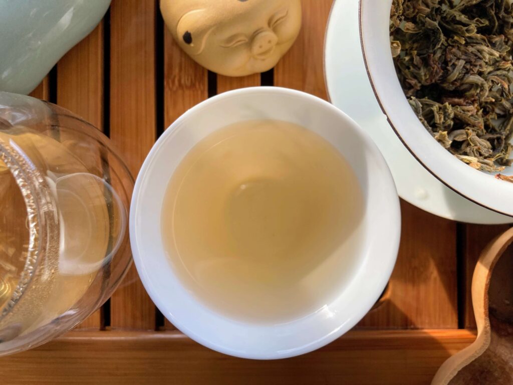 IMG_8443 tea liquor in white tea cup on wooden tray