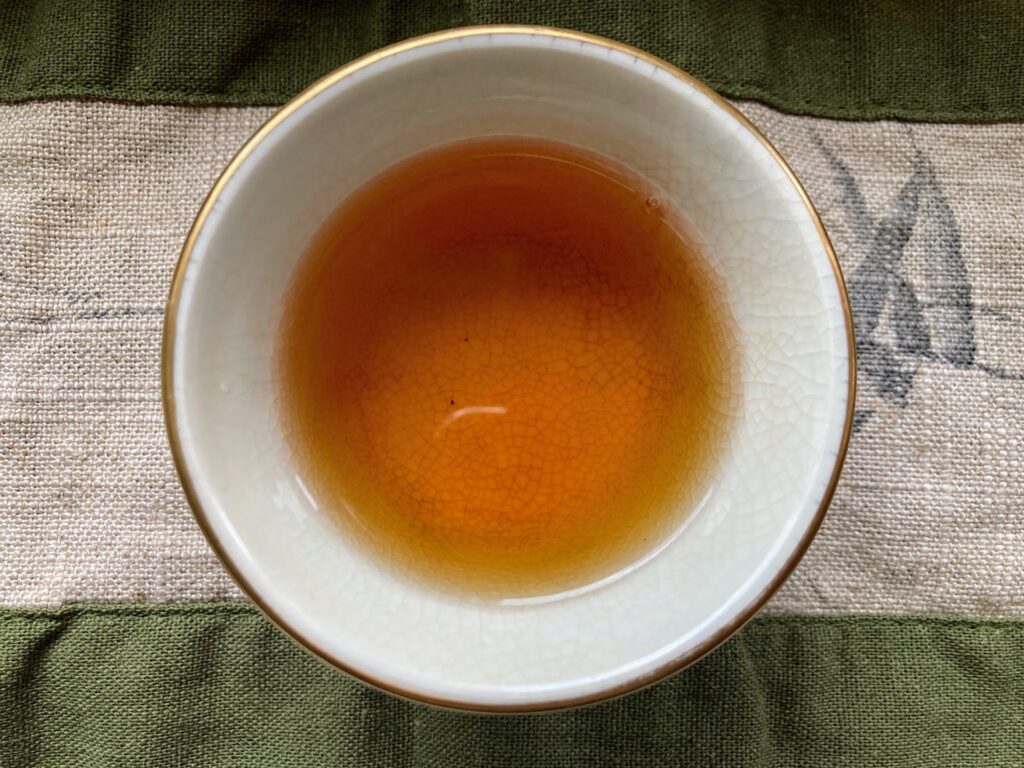 Yesheng Gushu Hongcha 2nd infusion Yesheng Gushu Hongcha tea liquor in cup