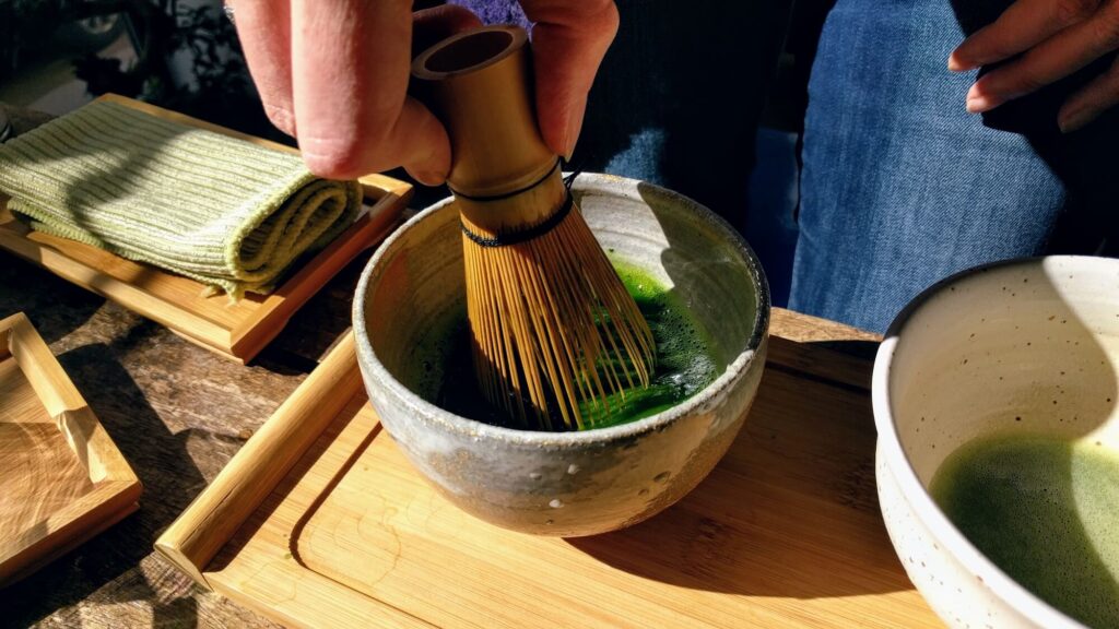 Matcha making at Teemaa web whisking matcha in a bowl