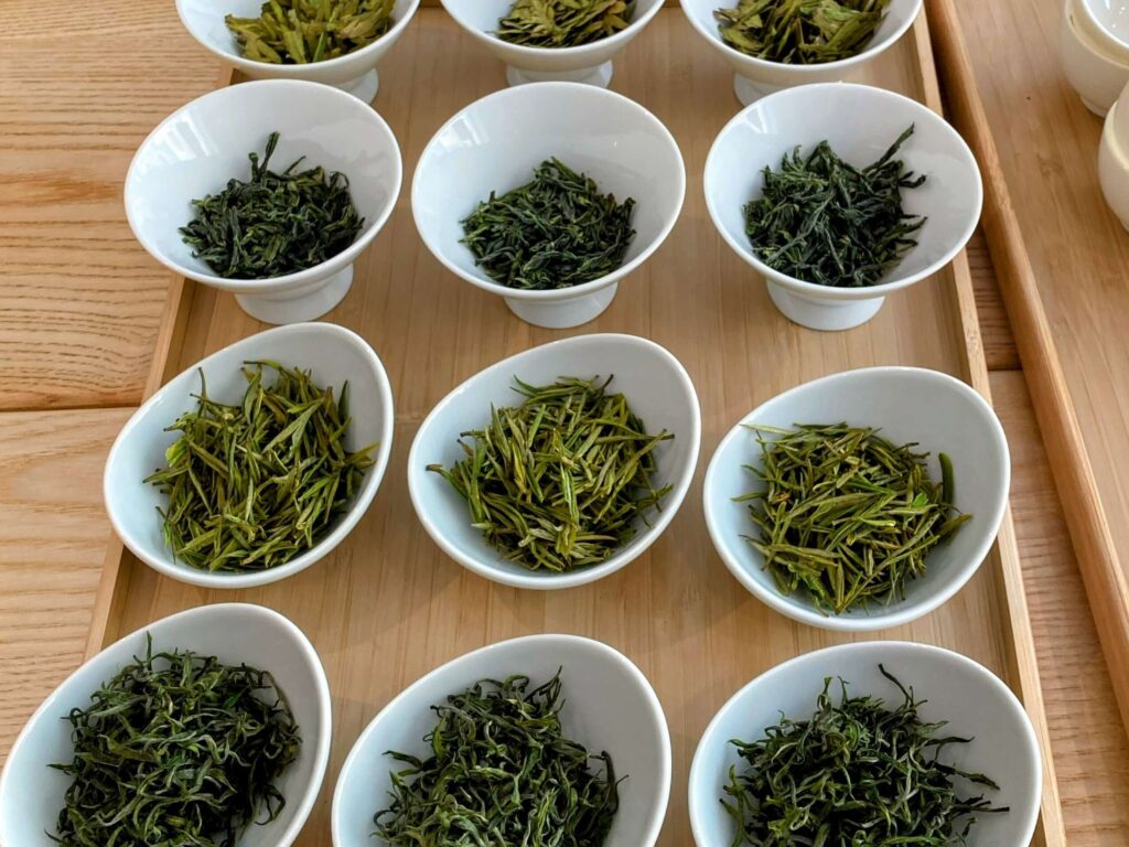 display of green teas in white bowls