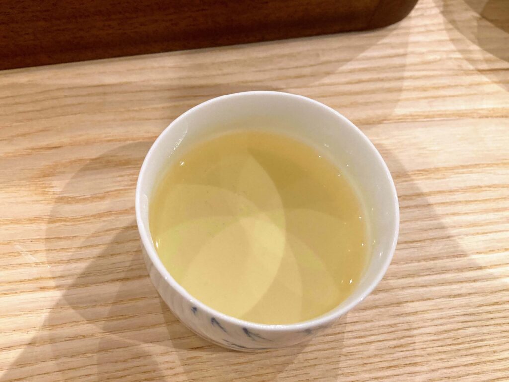 high mountain oolong tea liquor in white cup