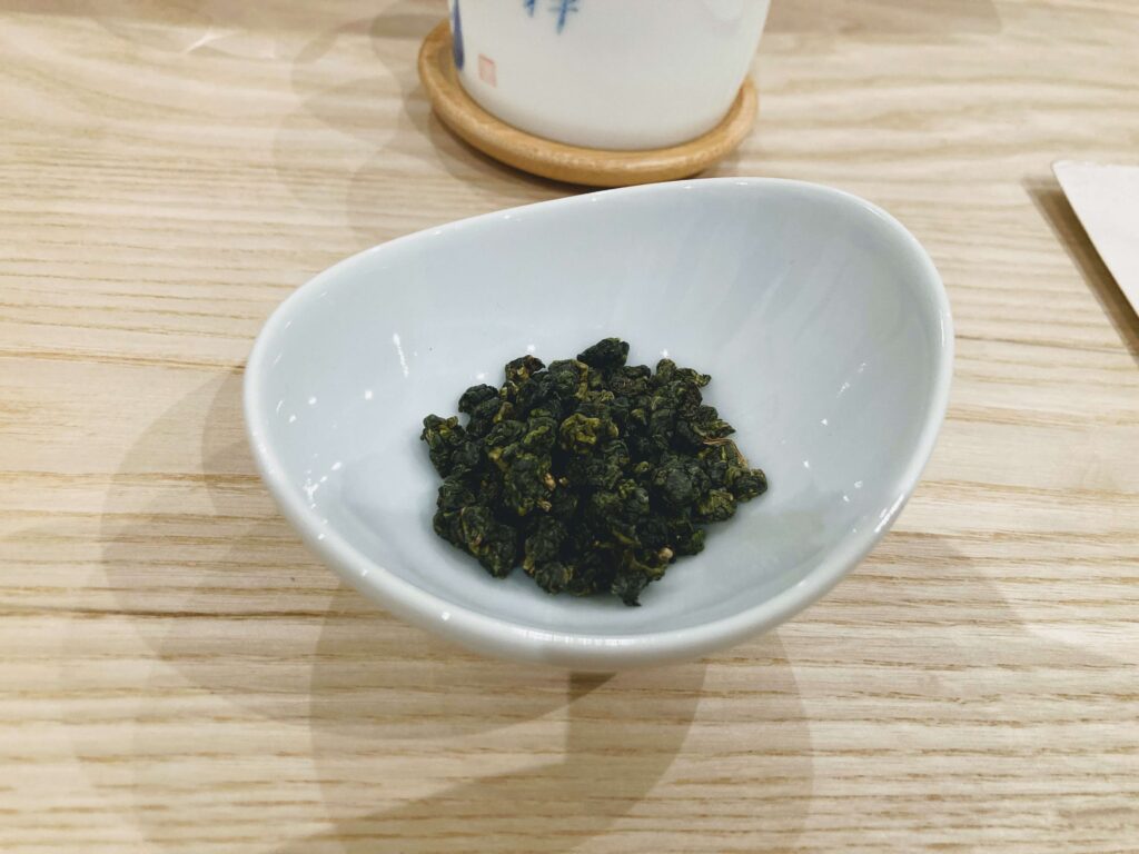 high mountain oolong dry tea leaves in white bowl