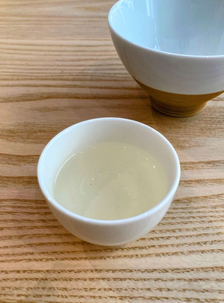 green tea liquor in white cup