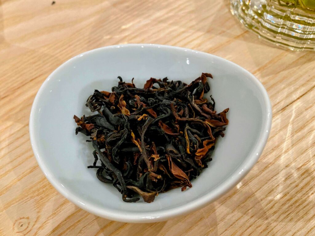 purple cultivar dry tea leaves in white bowl